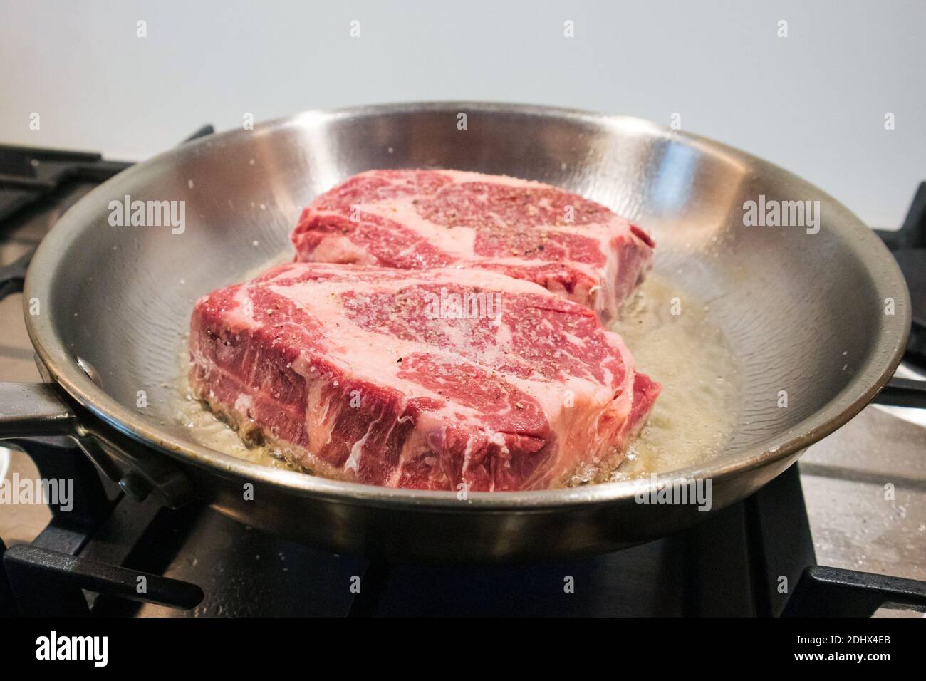 Ribeye beef steak in a pan. Ketogenic or carnivore diet. Stock Photo