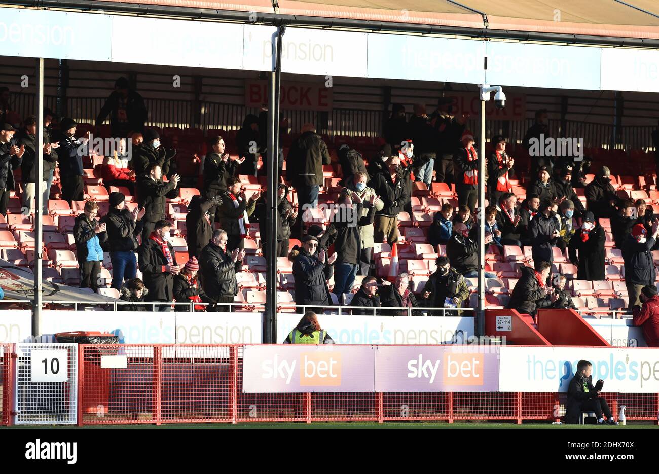 Crawley UK 12th December 2020 -  Crawley fans watch the Sky Bet EFL League Two match between Crawley Town and Barrow AFC  at the People's Pension Stadium - Editorial use only. No merchandising.  - for details contact Football Dataco  : Stock Photo
