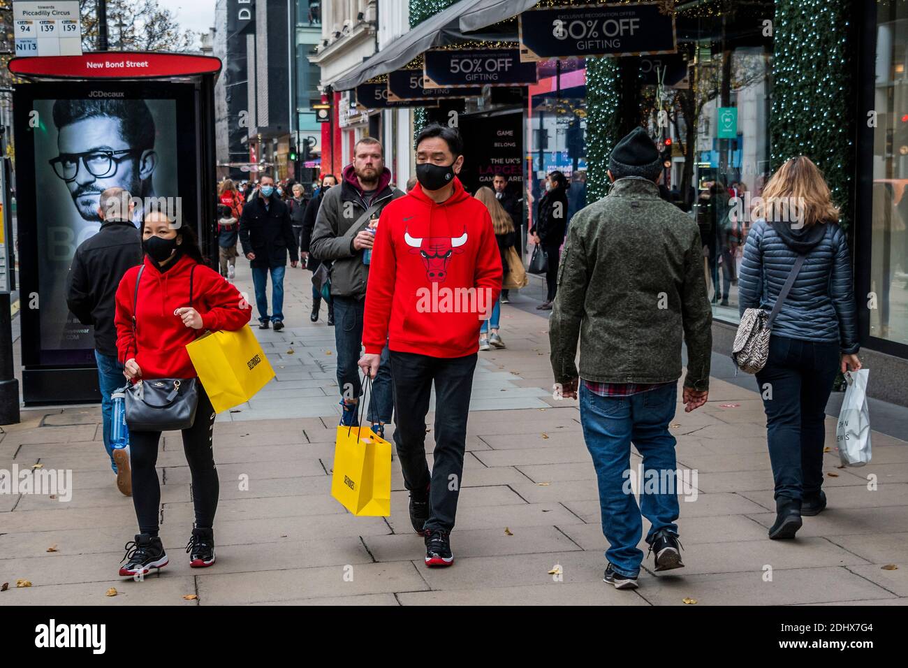 London, UK. 12th Dec, 2020. Oxford Street is busy and shoppers are out now the shops are open again. But these are still difficult times for retailers as they try to catch up after the second Coronavirus lockdown ends and Tier 3 for London is a distinct possibility. Credit: Guy Bell/Alamy Live News Stock Photo