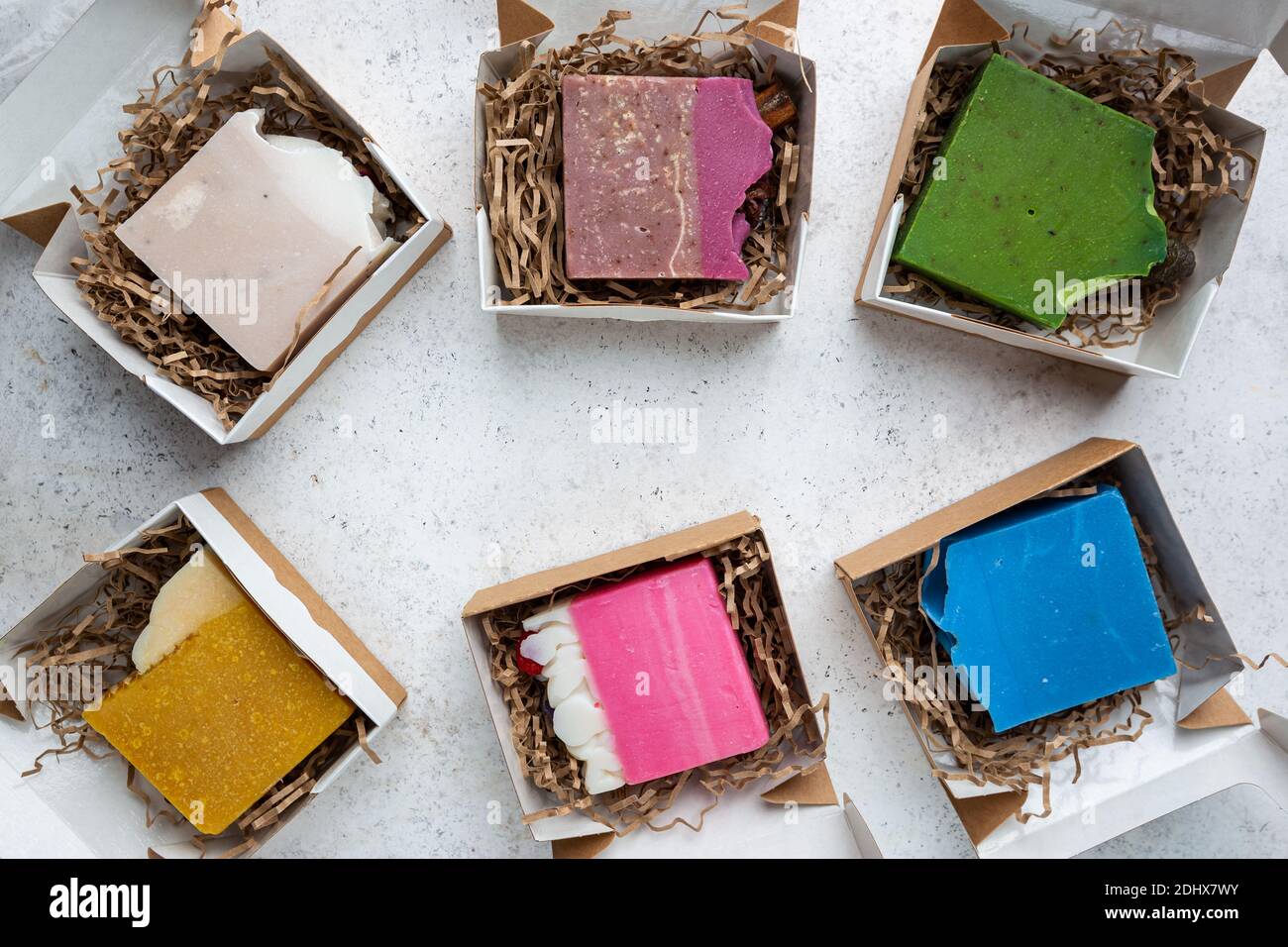 Different colorful pieces of natural homemade soap with herbs, fruits