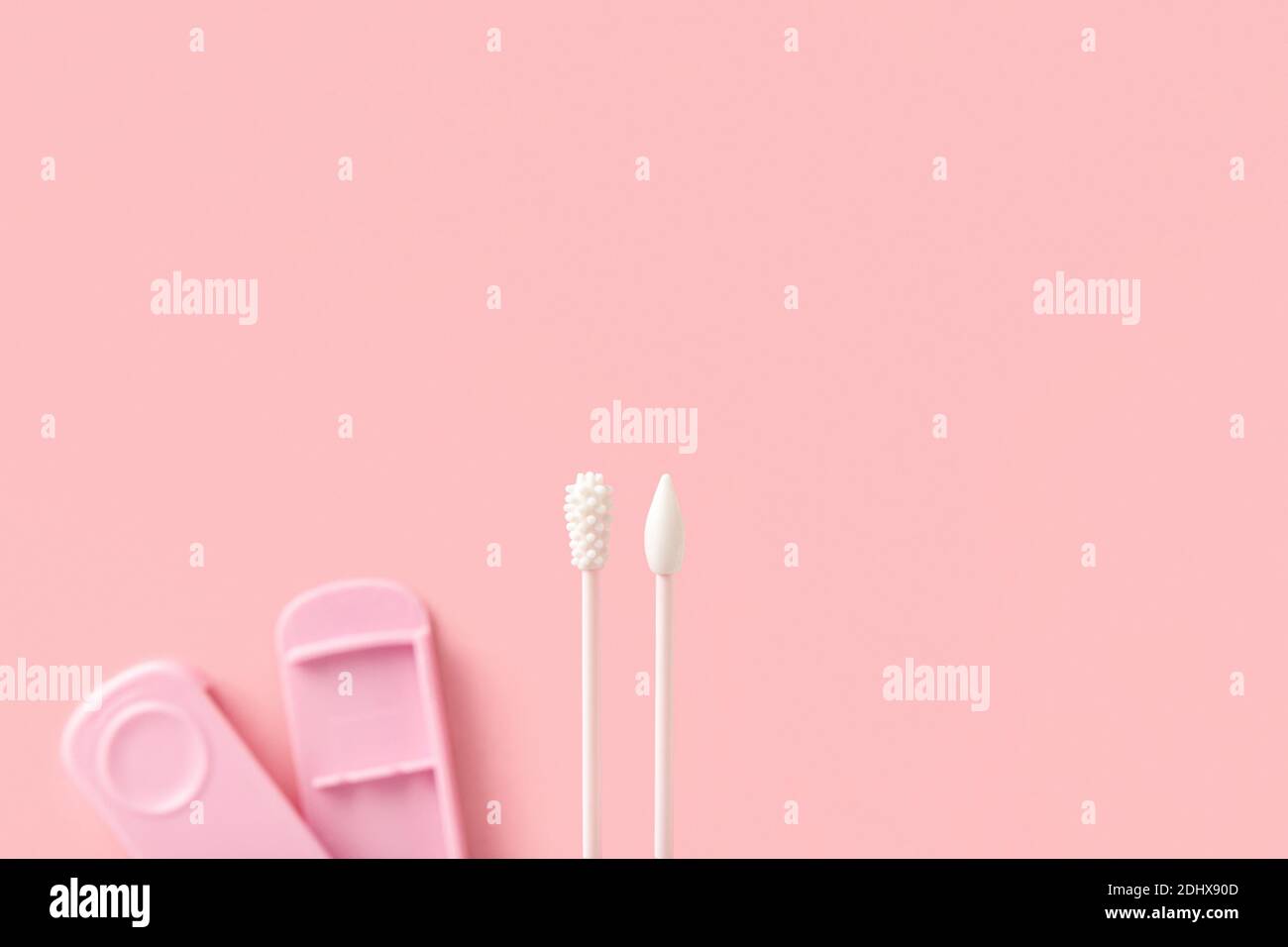 Reusable silicone swab on pink background. Alternative to cotton buds