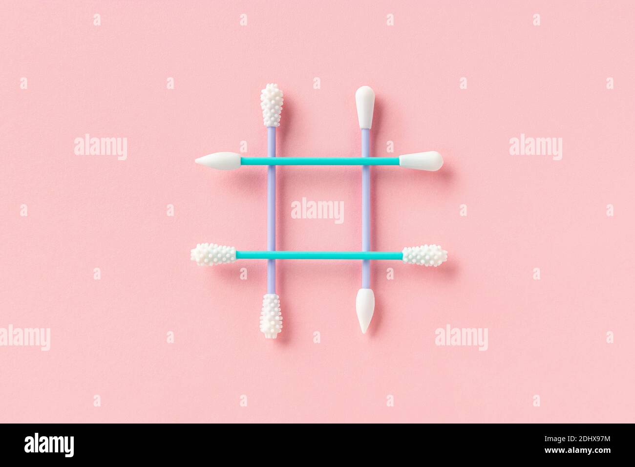 Reusable silicone swab on pink background. Alternative to cotton buds