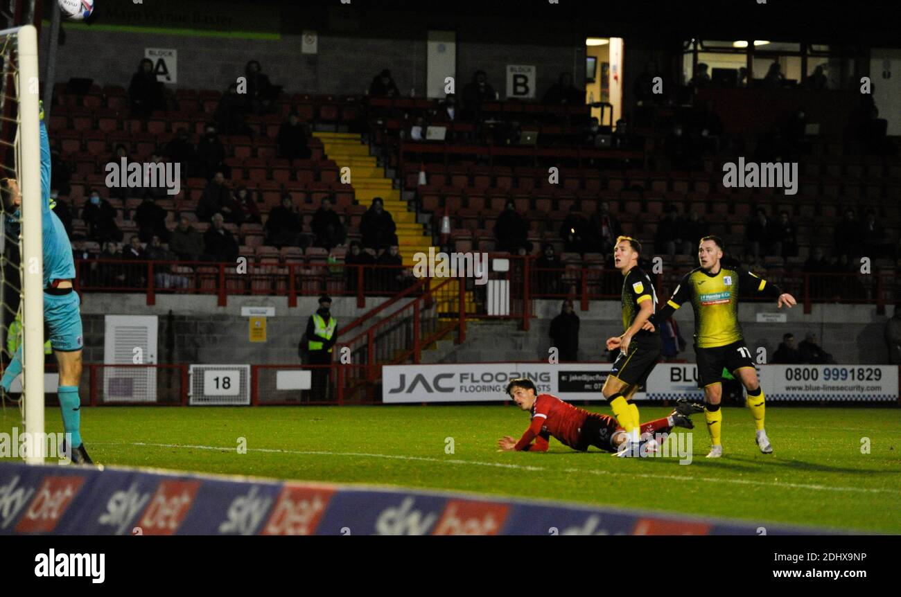 Crawley UK 12th December 2020 -  Tom Nichols of Crawley heads against the bar which led to their second goal scored by Max Watters during the Sky Bet EFL League Two match between Crawley Town and Barrow AFC  at the People's Pension Stadium - Editorial use only. No merchandising.  - for details contact Football Dataco  : Credit Simon Dack TPI / Alamy Live News Stock Photo