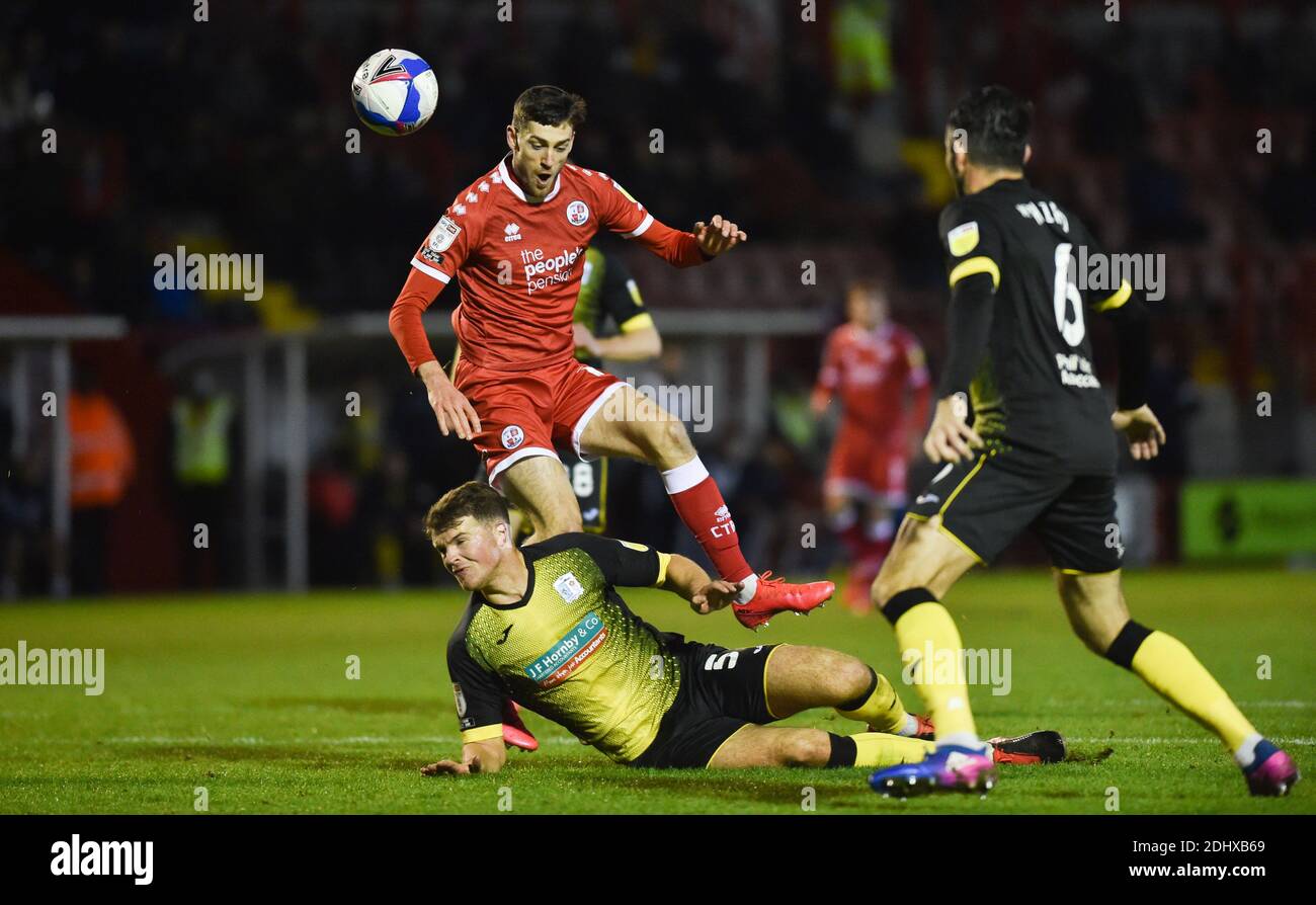 Crawley UK 12th December 2020 -  Ashley Nadesan of Crawley is brought down by Matthew Platt of Barrow for a penalty during the Sky Bet EFL League Two match between Crawley Town and Barrow AFC  at the People's Pension Stadium - Editorial use only. No merchandising.  - for details contact Football Dataco  : Credit Simon Dack TPI / Alamy Live News Stock Photo