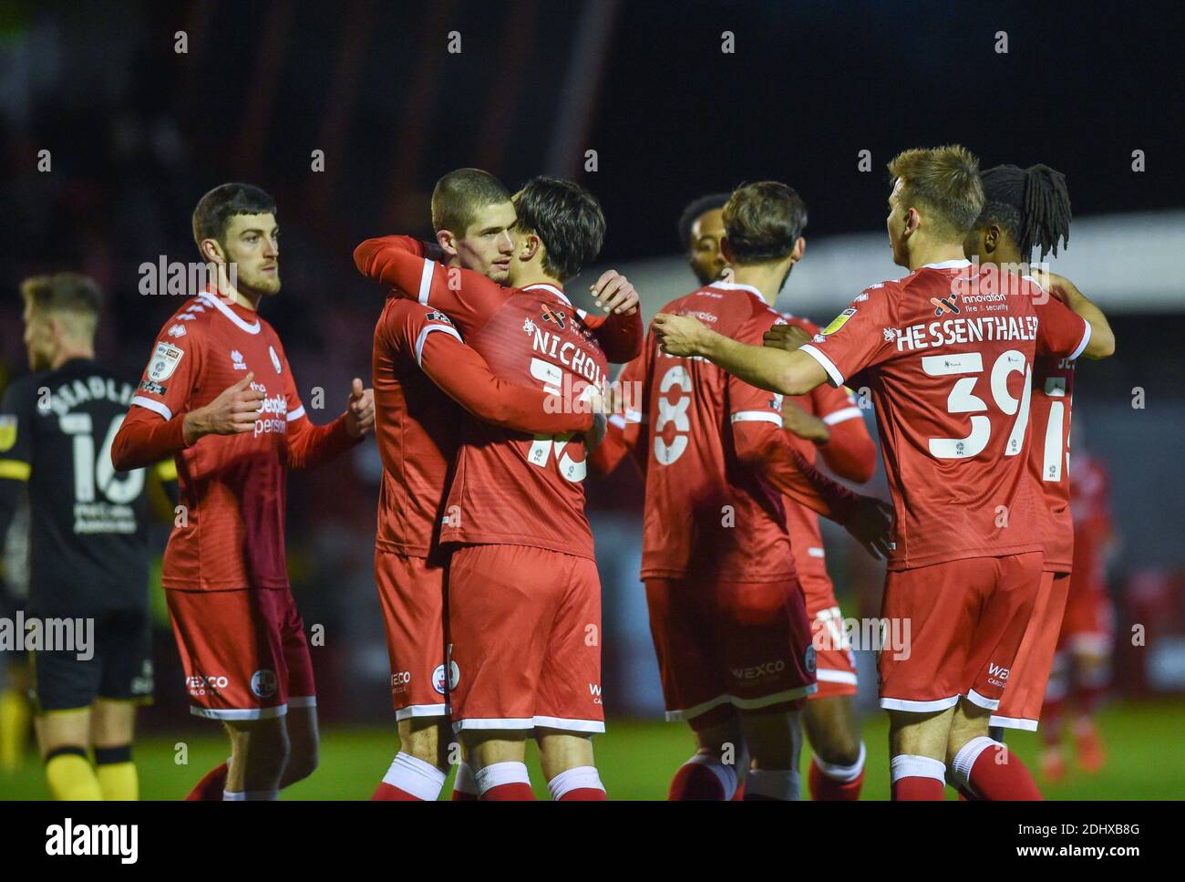 Crawley UK 12th December 2020 -  Tom Nichols of Crawley is mobbed  after scoring their third goal during the Sky Bet EFL League Two match between Crawley Town and Barrow AFC  at the People's Pension Stadium - Editorial use only. No merchandising.  - for details contact Football Dataco  : Credit Simon Dack TPI / Alamy Live News Stock Photo