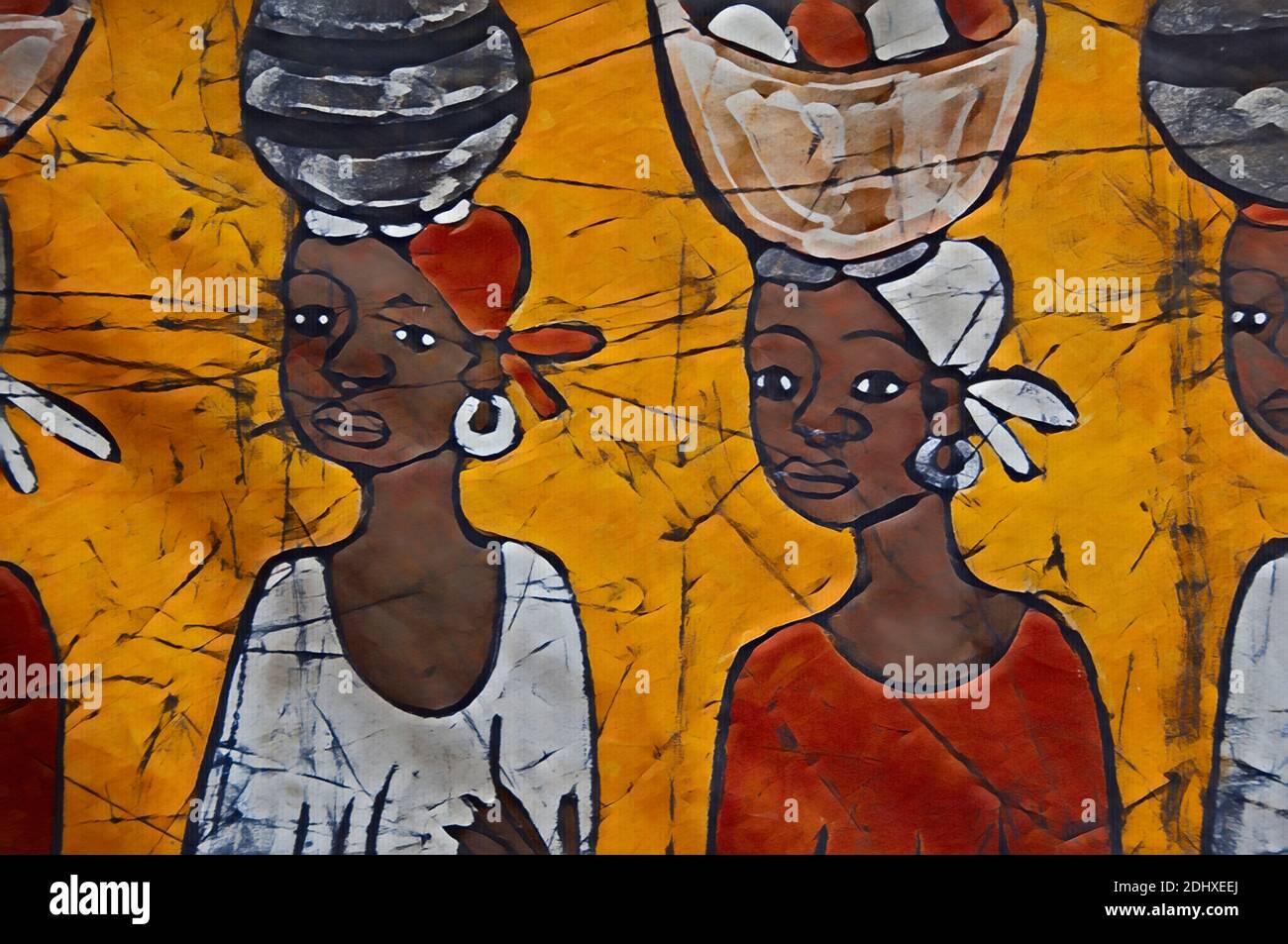 Africa, Gambia. Capital city of Banjul. Local batik workshop, colorful hand-painted textiles depicting every day African life & attire. Computerized Stock Photo