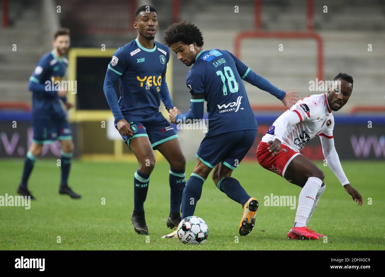 Mouscron, Belgium . 12th Dec, 2020. MOUSCRON, BELGIUM - DECEMBER 12: Ryan Sanusi of Beerschot battles for the ball with Fabrice Olinga of Mouscron during the Jupiler Pro League match day 16 between Royal Excel Mouscron and K. Beerschot V.A. on December 12, 2020 in Mouscron, Belgium. (Photo by Vincent Van Doornick/Isosport) Credit: Pro Shots/Alamy Live News Stock Photo