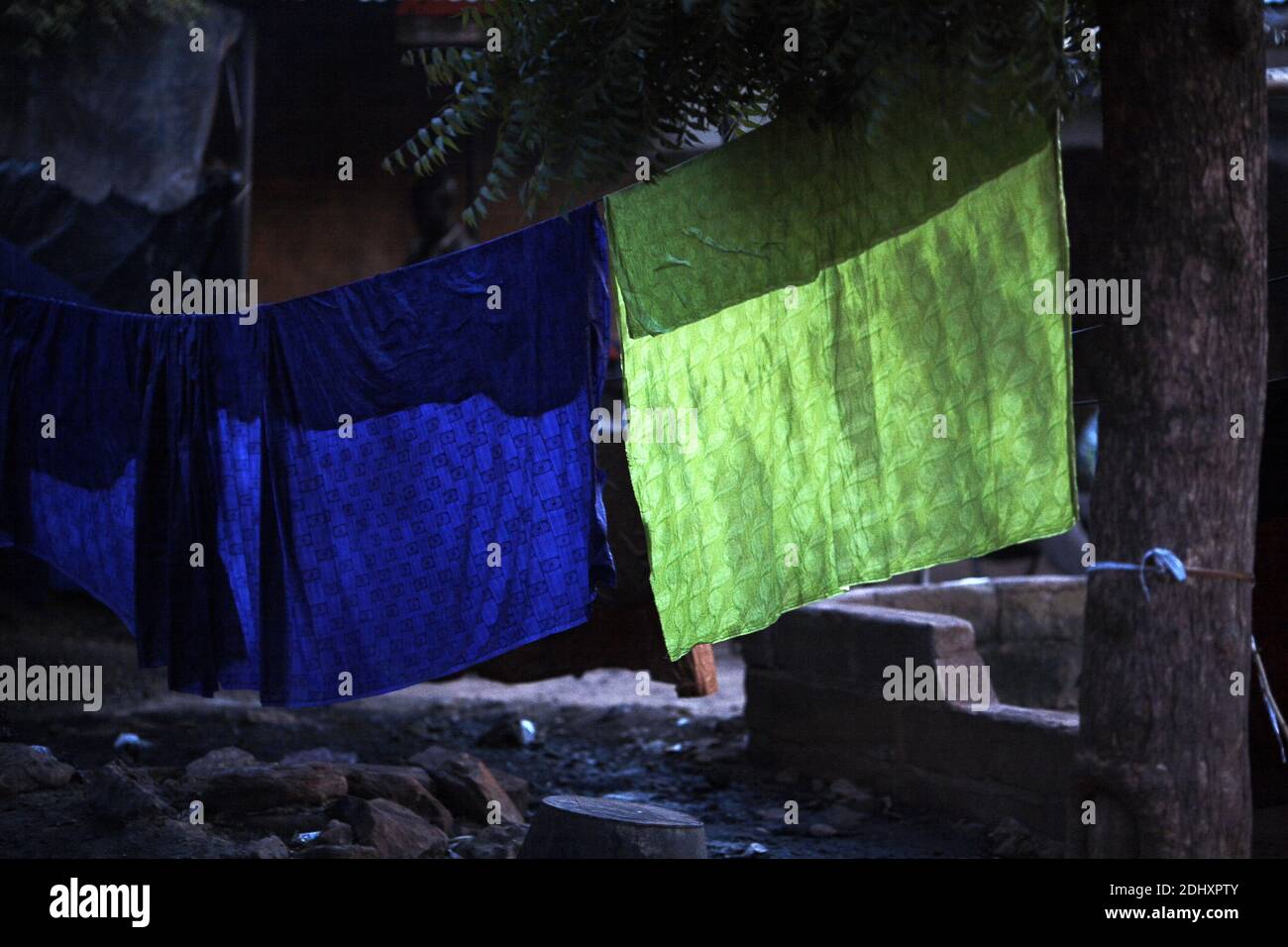 Africa /Mali/Bamako/Fabrics on a rope for drying. Stock Photo
