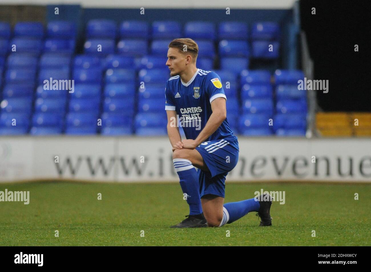 Ipswich, UK, 12th December. 2020. Ipswichs Luke Woolfenden takes a knee ahead of the Sky Bet League 1 match between Ipswich Town and Portsmouth at Portman Road, Ipswich on Saturday 12th December 2020. (Credit: Ben Pooley | MI News) Credit: MI News & Sport /Alamy Live News Stock Photo