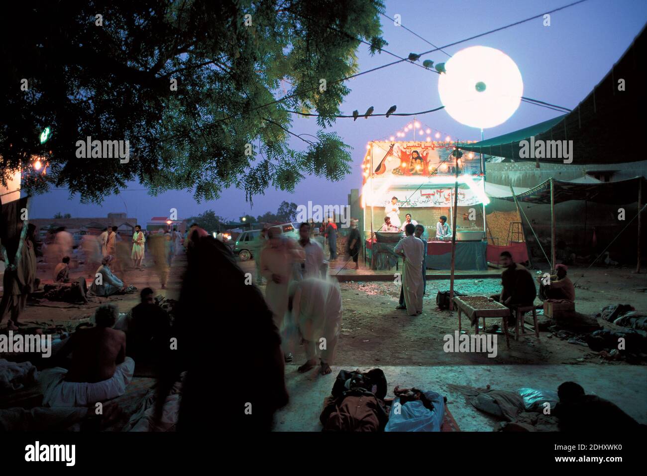 Sufi Music in the Indus Valley .Night life in front of the Shah Abdul Latif shrine in Sindh,Pakistan. Stock Photo