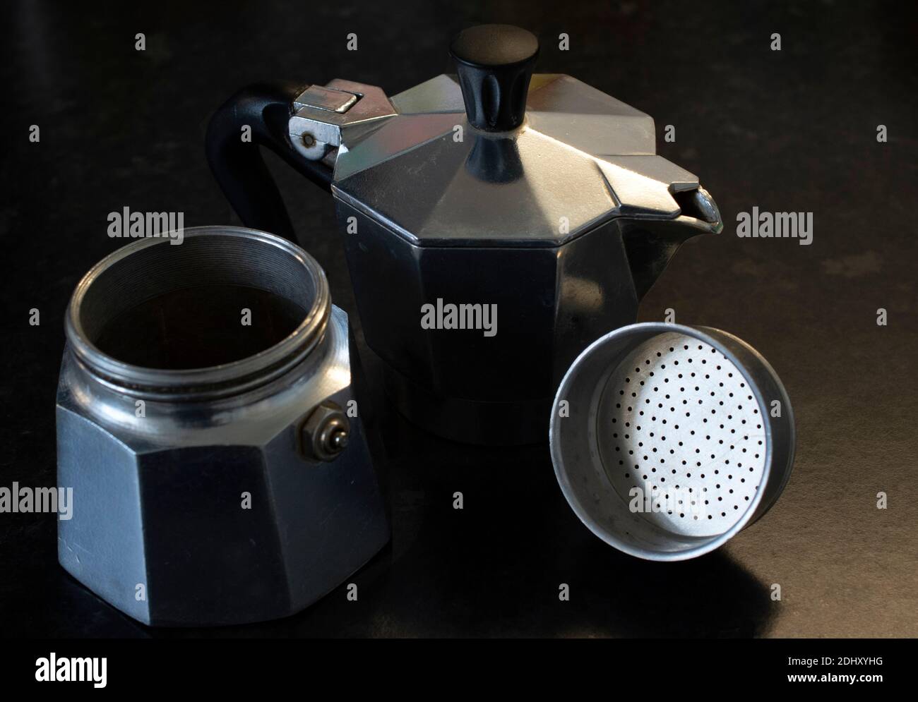 A disassembled moka pot / stove top coffee maker Stock Photo