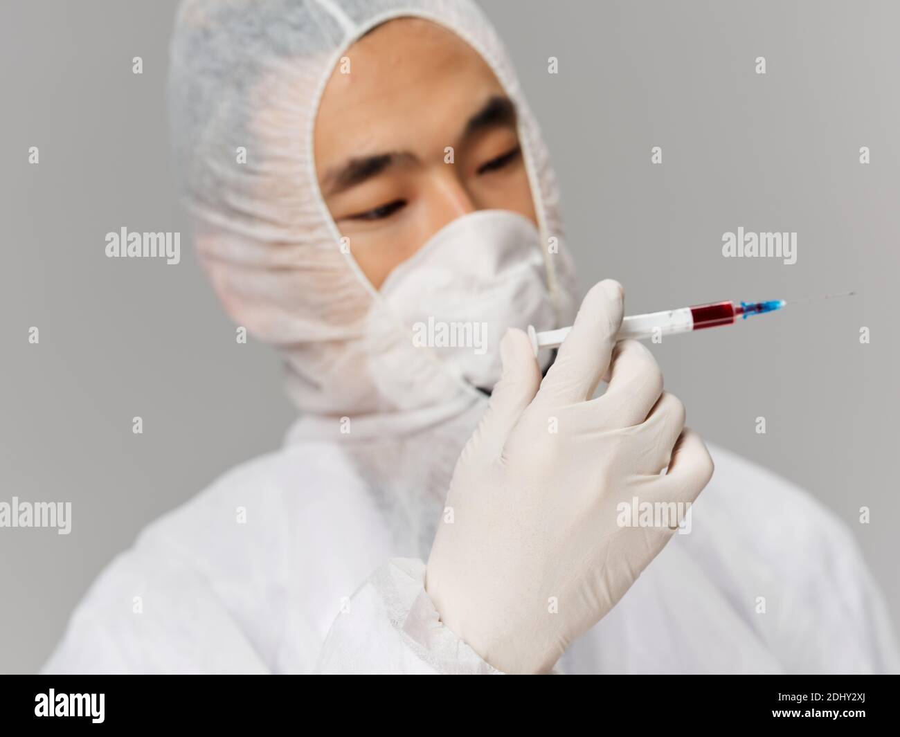 Asianlooking protective clothing microbiology research laboratory Gray