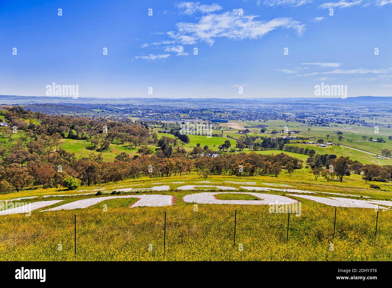 Famous Mount Panorama white big letters on hill side towards Bathurst city from australian motorsport car racing circle. Stock Photo