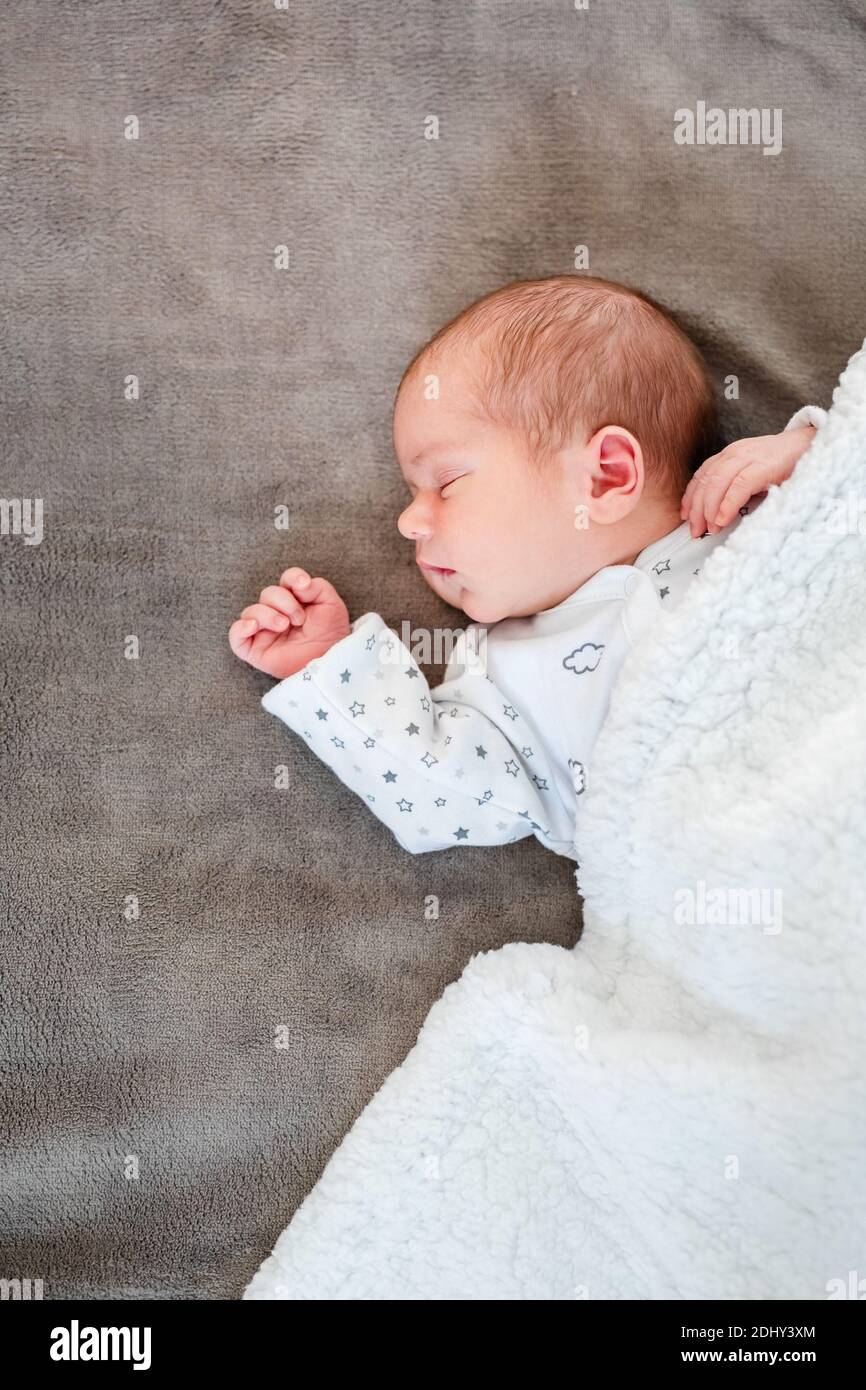 Newborn baby sleep first days of life. Cute little newborn child