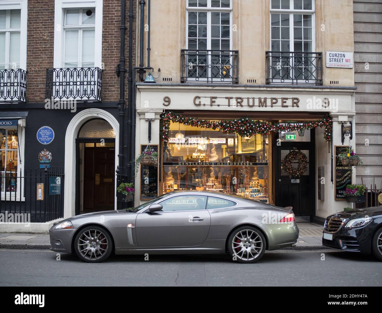 London, Greater London, England - Sports car parked outside a chic shop in London Stock Photo