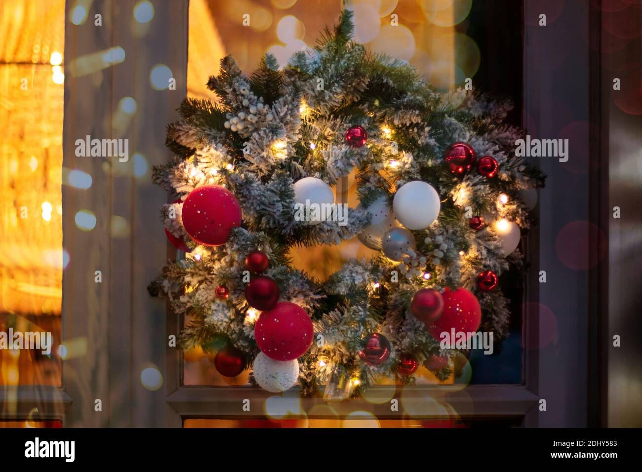 Christmas wreath made of fir branches with round balls of red, white ...