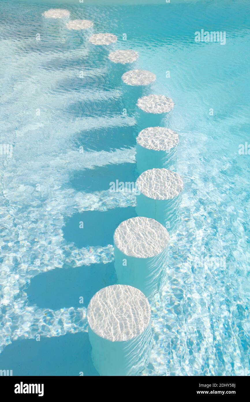 Round bar stools under water. Healthy lifestyle, adventure. Outdoor pool on  a sunny summer day. Background. Clear turquoise water in the pool. Rest, t  Stock Photo - Alamy