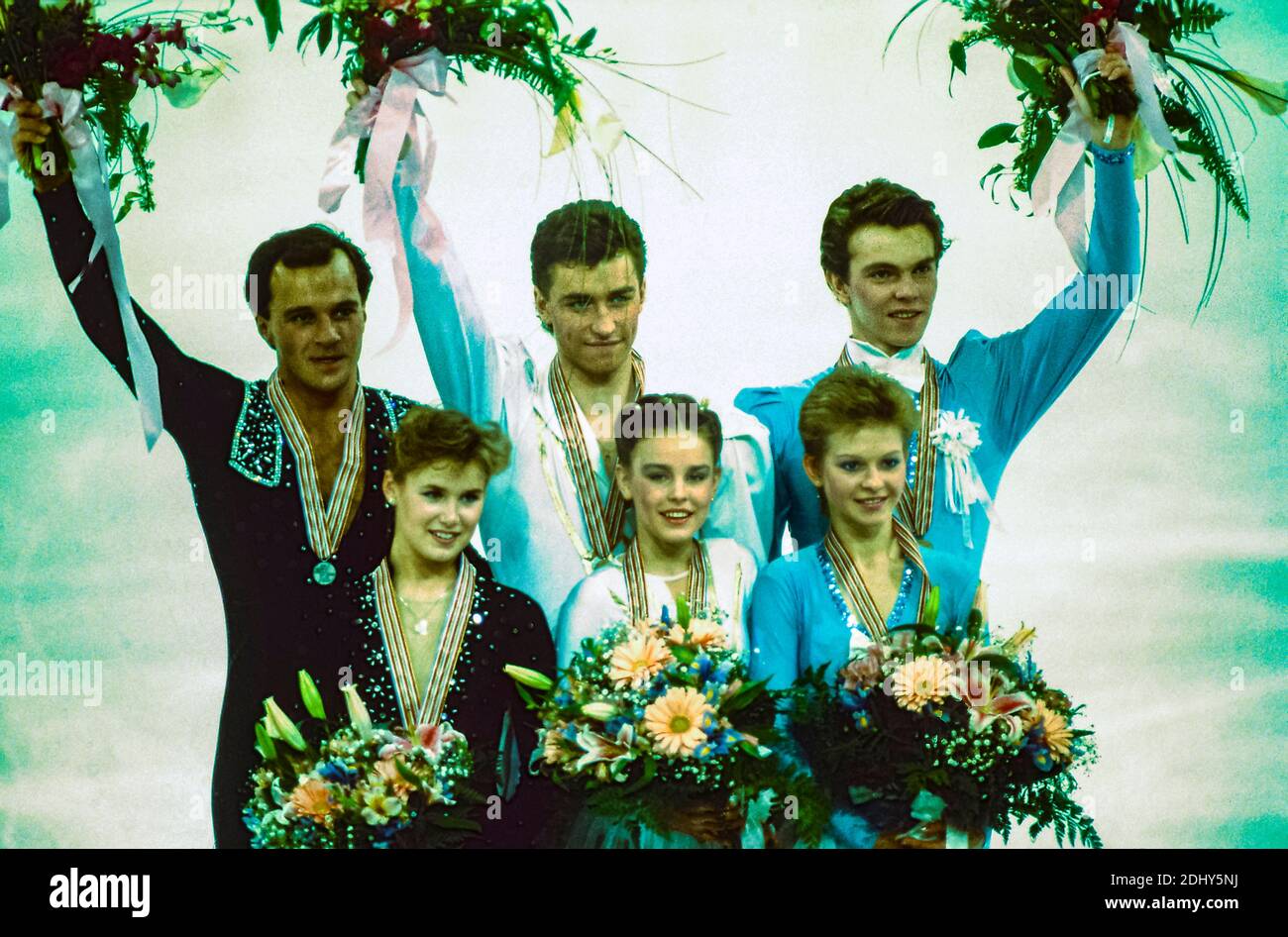 Ekaterina Gordeeva / Sergei Grinkov (URS) gold medalist (C) Cindy Landry / Lyndon Johnston (CAN) silver (L) and Elena Bechke / Denis Petrov (URS) bronze winners in pairs figure skating at the 1989 World Figure Skating Championships Stock Photo
