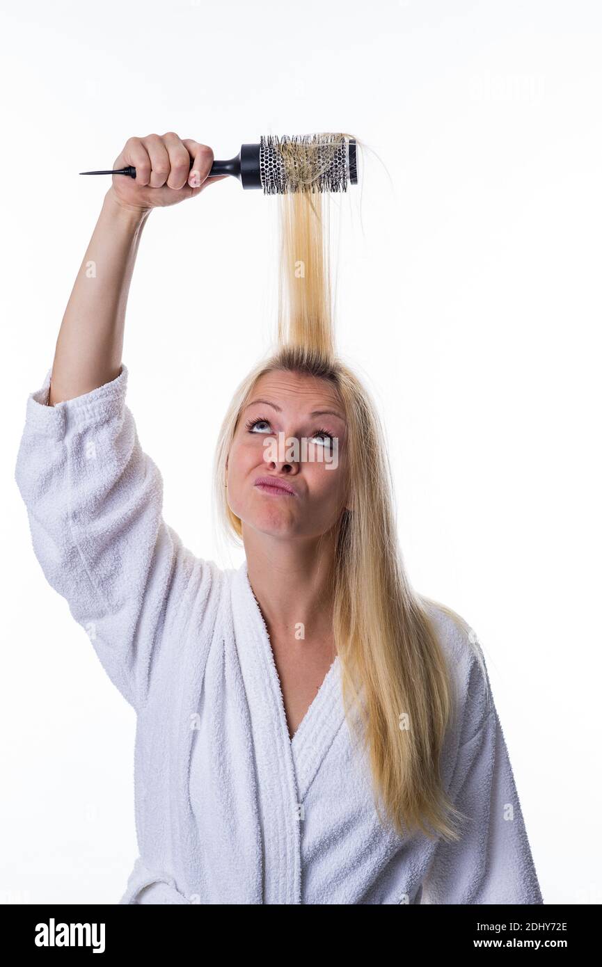 Blonde Frau mit Haarbürste, Lockenbürste, Stock Photo