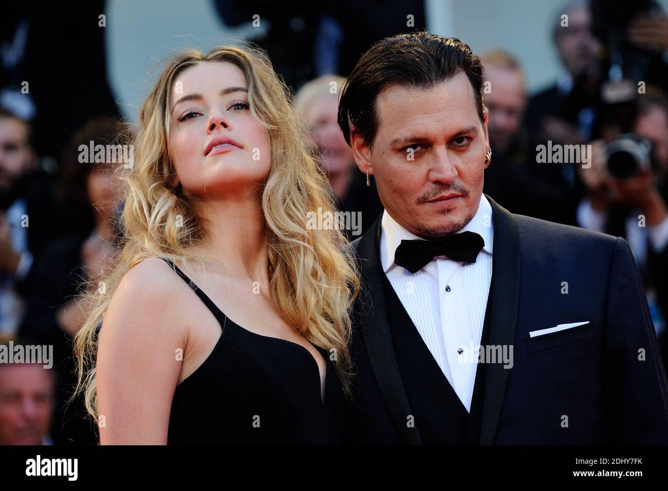 File photo : File photo : Amber Heard and Johnny Depp attending the 'Black Mass' Premiere during the 72nd Venice International Film Festival (Mostra) on the Lido in Venice, Italy on September 04, 2015. Actor Johnny Depp and his wife Amber Heard are divorcing after 15 months of marriage. Amber, 30, cited irreconcilable differences and is seeking spousal support from the Pirates Of The Caribbean star, according to court records. The pair, who do not have children together, married in February last year after co-starring in the 2011 film The Rum Diary. Johnny Depp’s lavish spending led him to bri Stock Photo