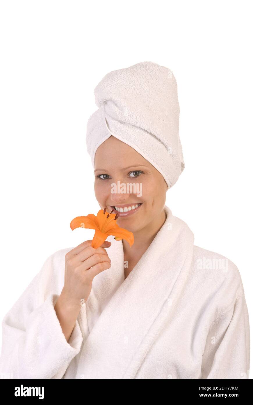 Frau im Bademantelmit einer Lilie Stock Photo