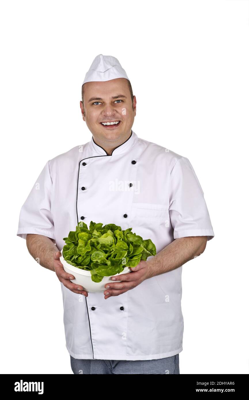 Koch bei der Arbeit, mit Salat in der Hand Stock Photo - Alamy