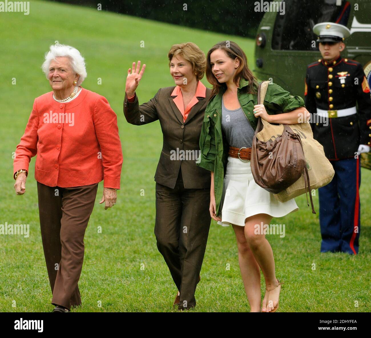 First lady Laura Bush waves to onlookers as she walks with former first lady Barbara Bush (L) and daughter Barbara as they arrive at the White from a weekend at the Crawford, Texas ranch, 11 May 2008 in Washington, DC, USA. United States President George W. Bush, whose daughter Jenna married Henry Hager at the ranch, described the experience as 'spectacular' and 'it's all we could have hoped for'. Photo by Mike Theiler/CNP/ABACAPRESS.COM Stock Photo