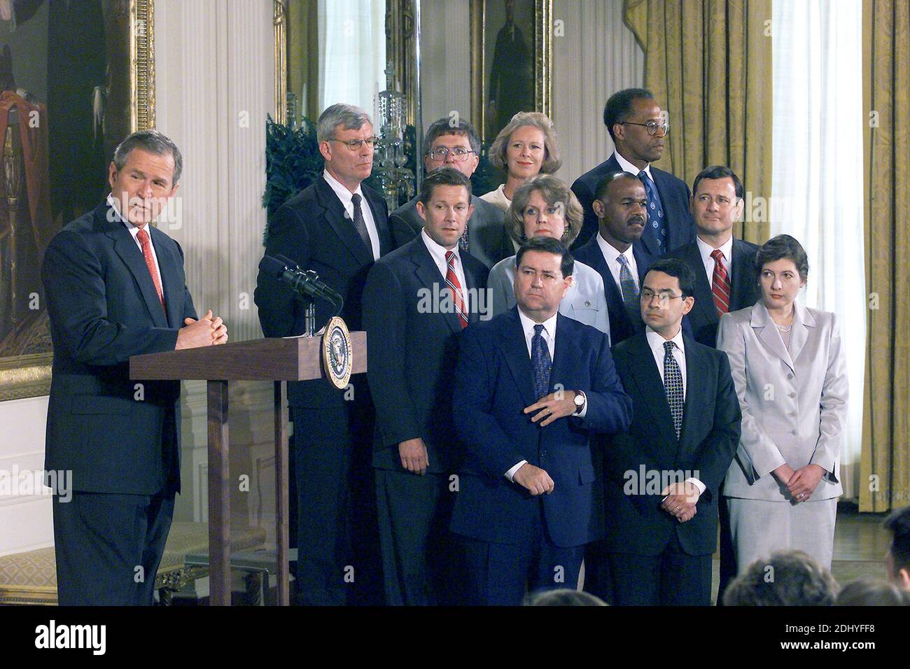 United States President George W. Bush with 11 of his first nominees for Federal judiciary nominations in an event in the East Room of the White House, May 9, 2001. The judges, left to right, Front row, Judge Dennis Shedd, Migues Estrada and Judge Priscilla Owens; Second row, Jeffrey Sutton, Judge Edith Brown Clement, Judge Roger Gregory and John Roberts; Back row, Judge Terrence Boyle, Michael McConnell, Judge Deborah Cook and Judge Barrington Parker.Photo by CNP/ABACAPRESS.COM Stock Photo