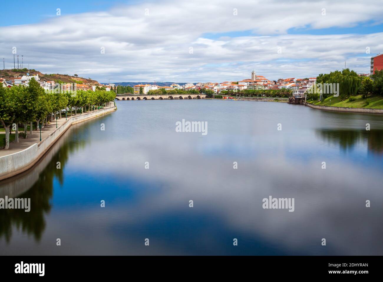 Urban landscape of the city of Mirandela in the north of Portugal. Panoramic view of the banks of the river Tua with the traditional Roman bridge and Stock Photo
