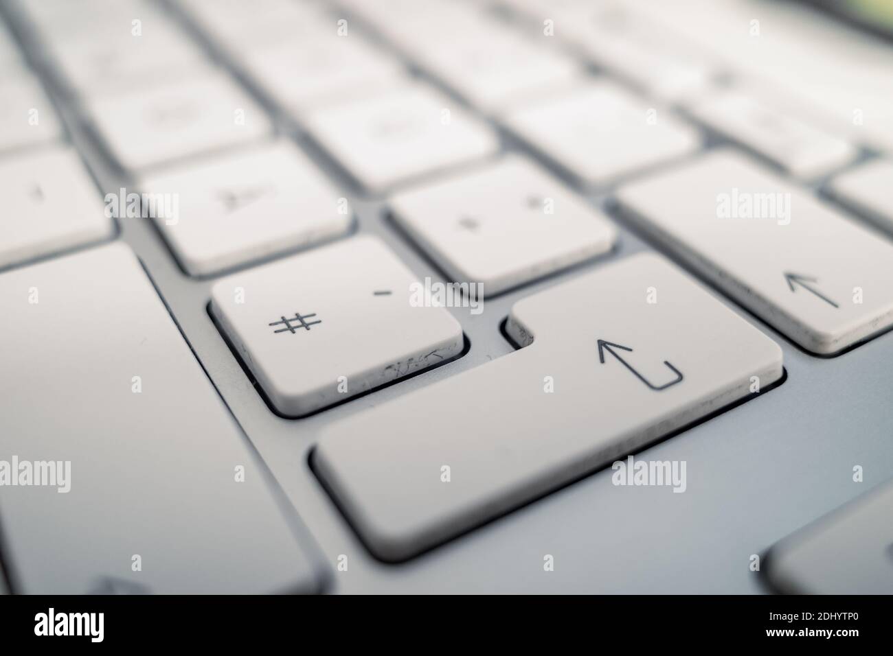 Close up and macro detail view at Enter white keypad buttons of German