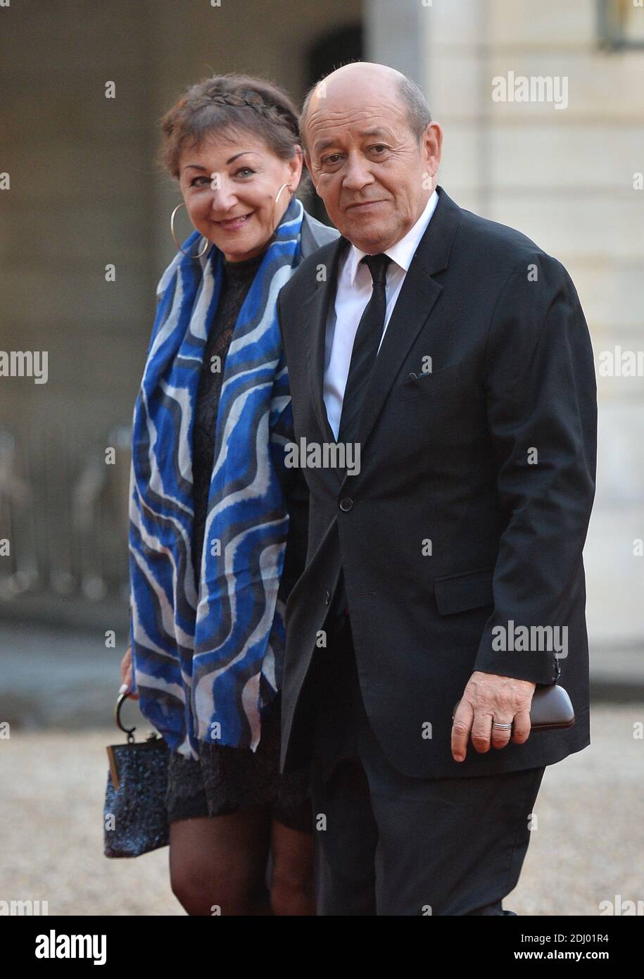 French Minister of Defence Jean-Yves Le Drian and his wife Maria Vadillo  arriving at the Elysee Palace for a state dinner hosted by French President  Francois Hollande in the honor of the