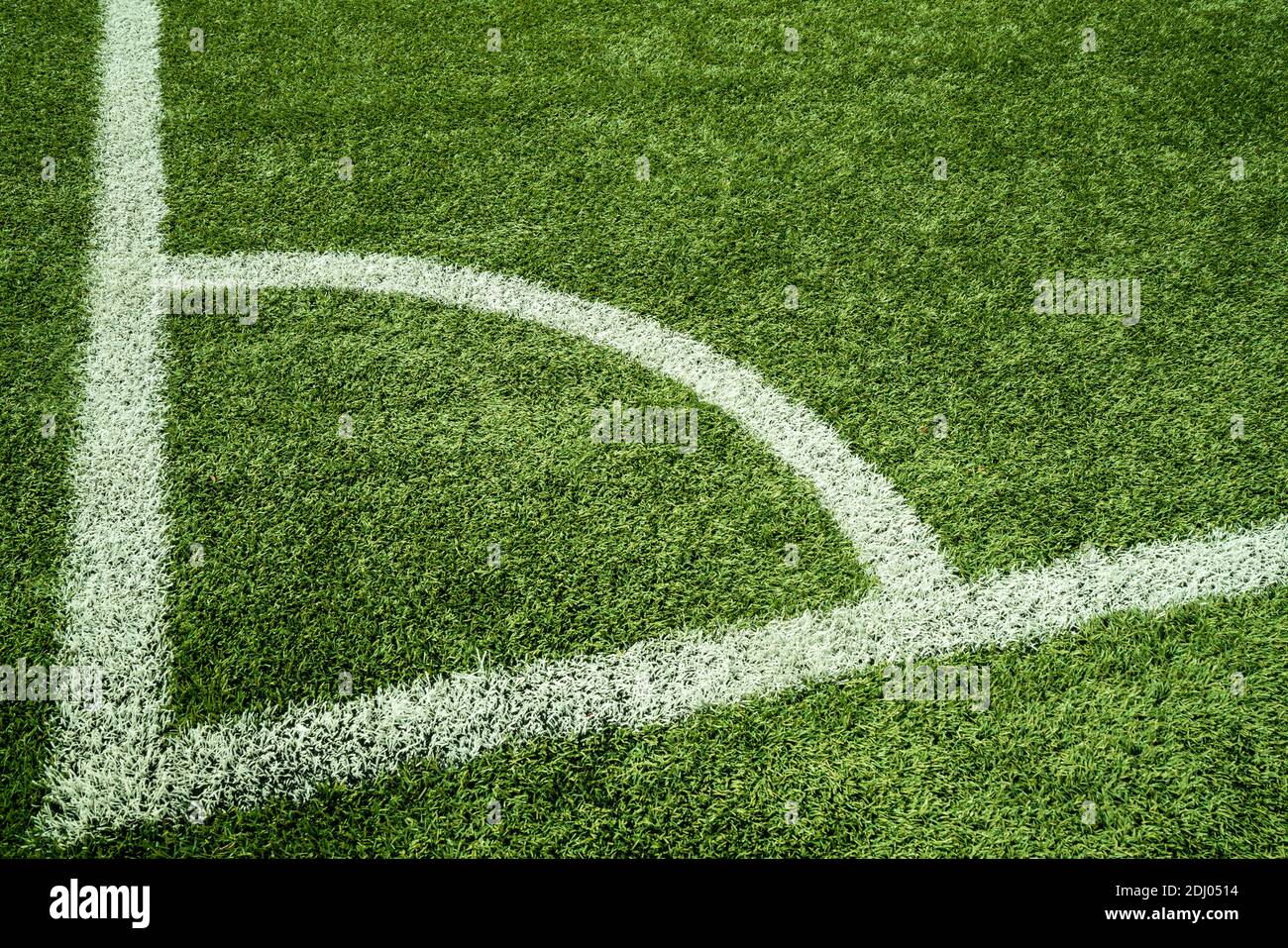 Green Artificial Grass Turf Field with White Line Boundary Stock Photo