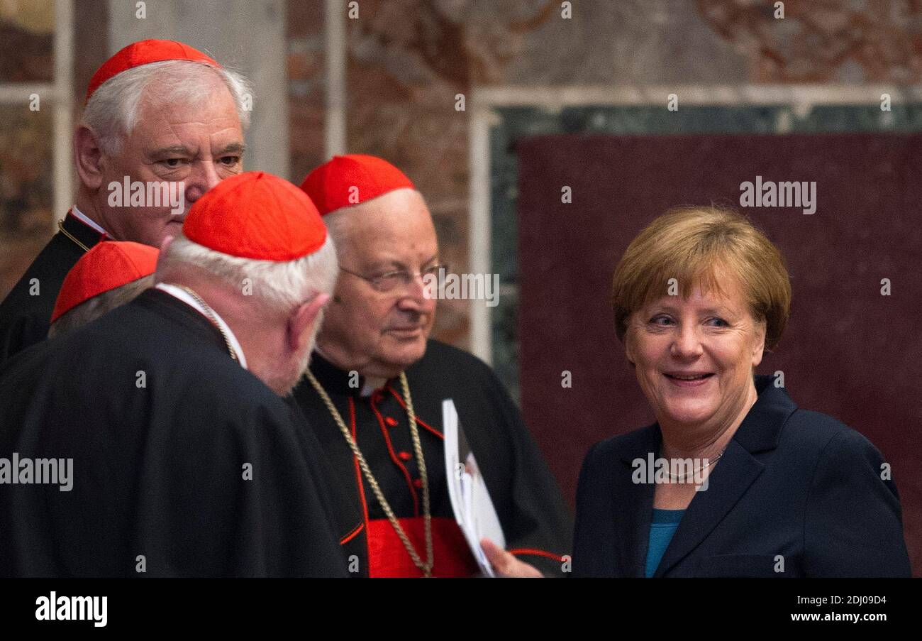 German Chancellor Angela Merkel, cardinals Gerhard Ludwig Muller, Reinhard Marx, Walter Kasper and Angelo Sodano attend the Charlemagne Prize of Aachen ceremony at the Reggia Hall on May 6, 2016 in Vatican City, Vatican. Pope Francis received the Charlemagne Prize, awarded annually since 1950 by the German city of Aachen to people who have contributed to the ideals upon which Europe has been founded, with top EU officials in attendance. The pope received the prize from the head of the awarding committee, Juergen Linden, and Aachen Mayor Marcel Philipp, watched by German Chancellor Angela Merke Stock Photo