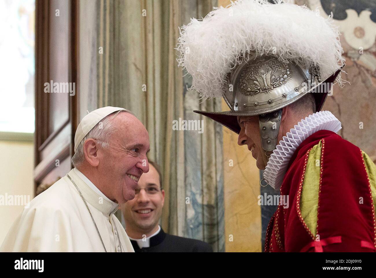 Pope Francis greets Swiss Guard commander Lt. Col. Christoph Graf on May 7, 2016 in the Clementine hall at the Vatican, one day after new members of the corps took their oath of allegiance and were sworn into active service. Pope Francis recalled the spirit of faithful service that animates the great legacy of sacrifice and heroism in his remarks to new recruits and their families. The Swiss Guards hold their swearing-in ceremony each year on May 6th, to mark the day in 1527 when 147 members of their corps gave their lives in a desperate rear-guard action that allowed Pope Clement VII to reach Stock Photo