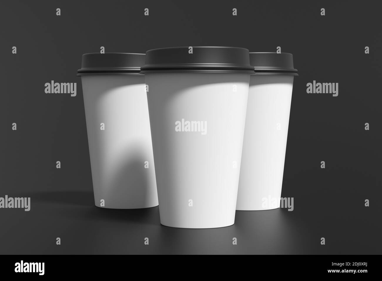 Three white take away coffee paper cups mock up with black lids on