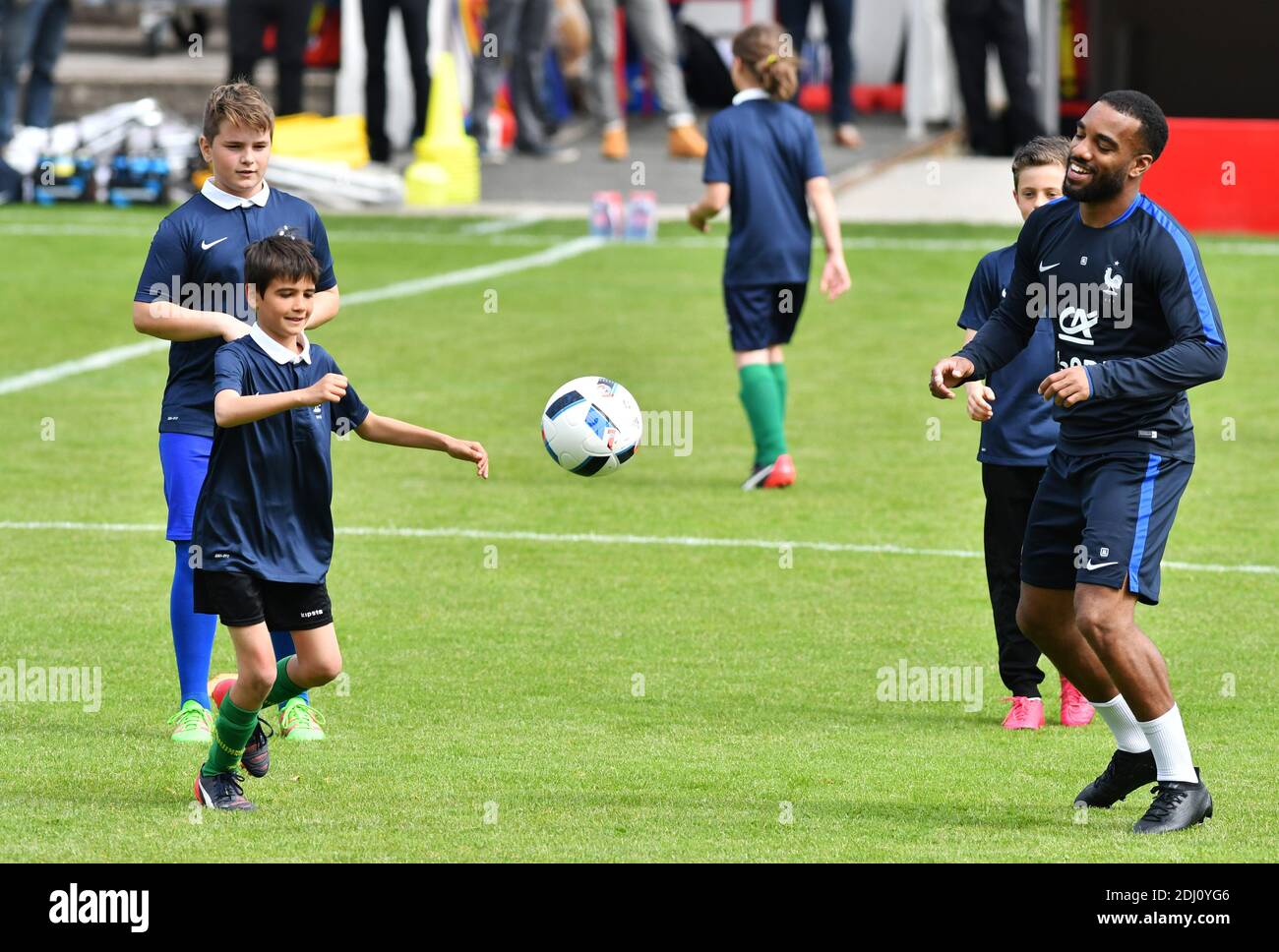 Alexandre Lacazette playing with children at the Aguilera stadium in Biarritz, France on May 18, 2016, as part of the team's preparation for the upcoming Euro 2016 European football championships. Photo by Pascal Rondeau/ABACAPRESS.COM Stock Photo