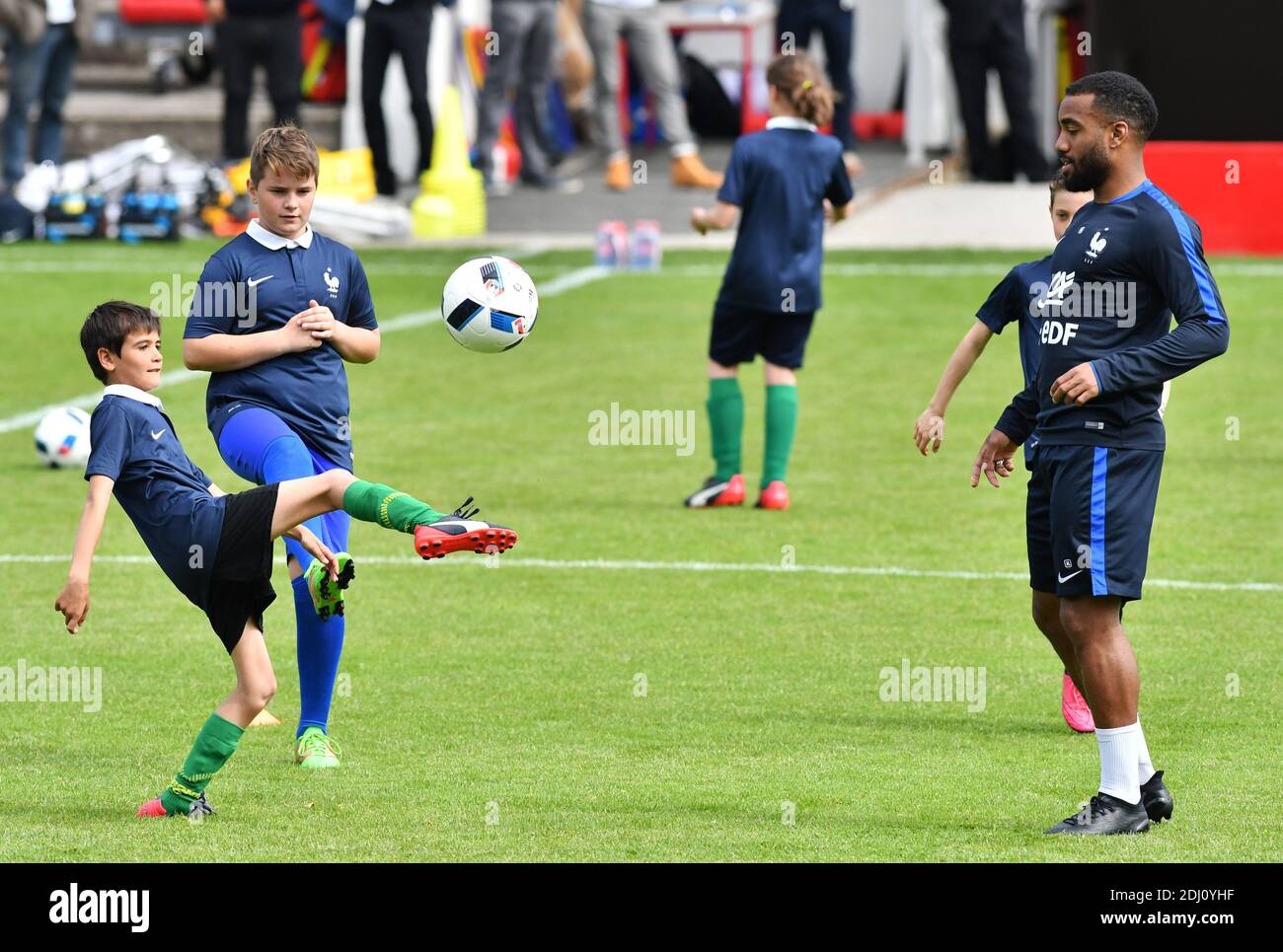 Alexandre Lacazette playing with children at the Aguilera stadium in Biarritz, France on May 18, 2016, as part of the team's preparation for the upcoming Euro 2016 European football championships. Photo by Pascal Rondeau/ABACAPRESS.COM Stock Photo