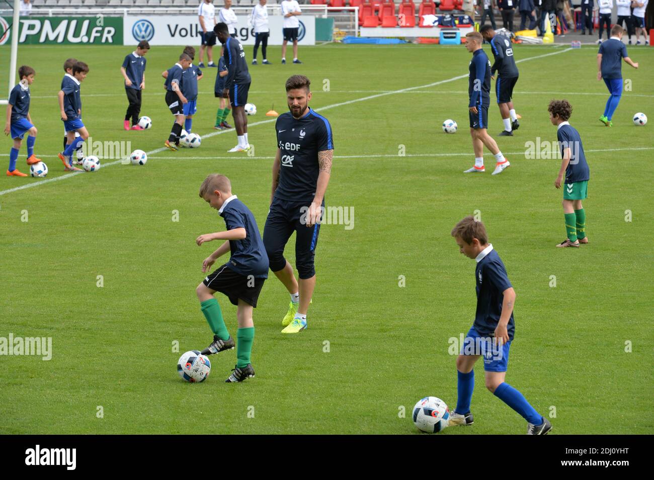 Olivier Giroud playing with children at the Aguilera stadium in Biarritz, France on May 18, 2016, as part of the team's preparation for the upcoming Euro 2016 European football championships. Photo by Pascal Rondeau/ABACAPRESS.COM Stock Photo