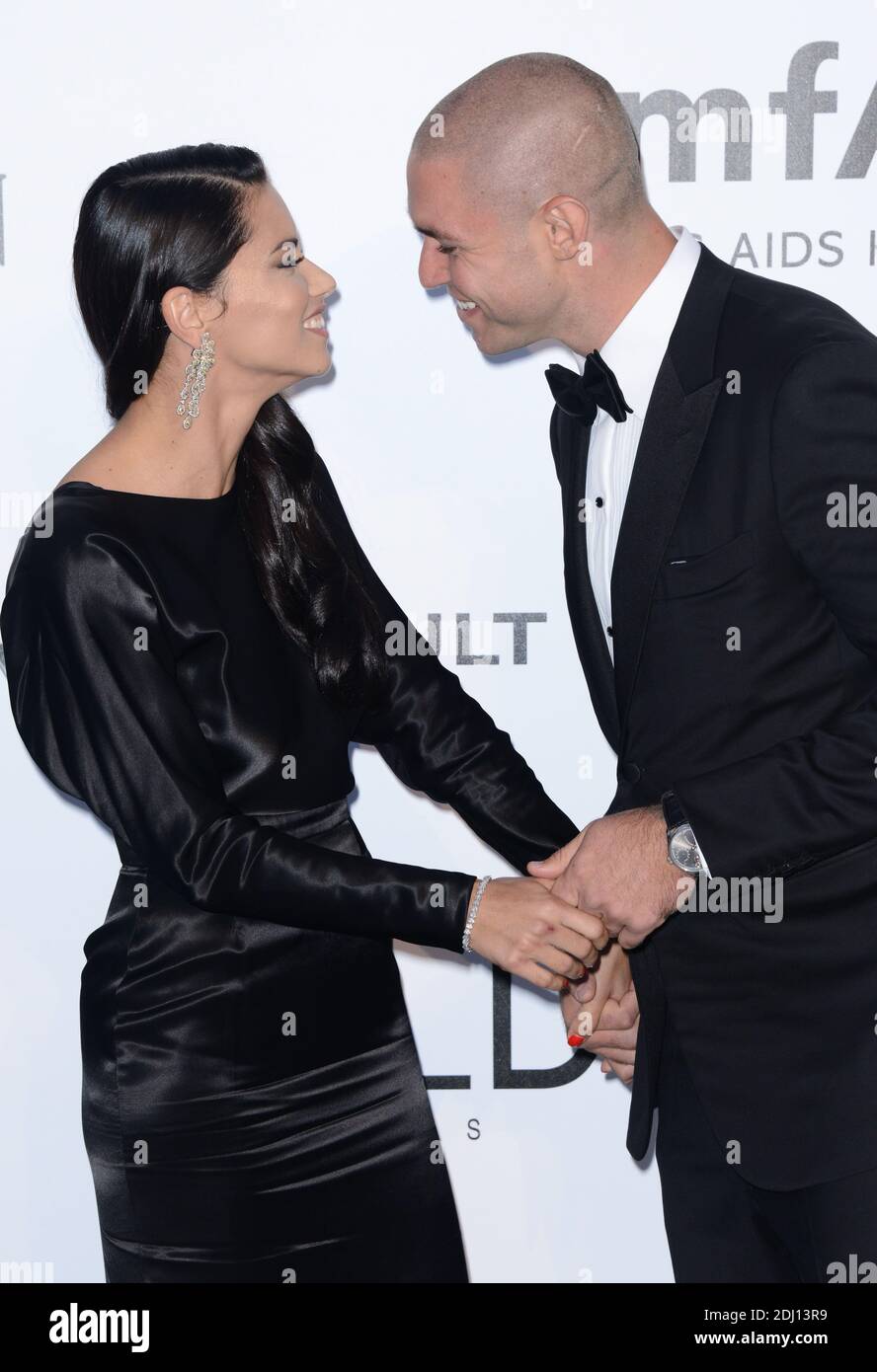 Adriana Lima and her boyfriend Joe Thomas attending amfAR's 23rd Cinema