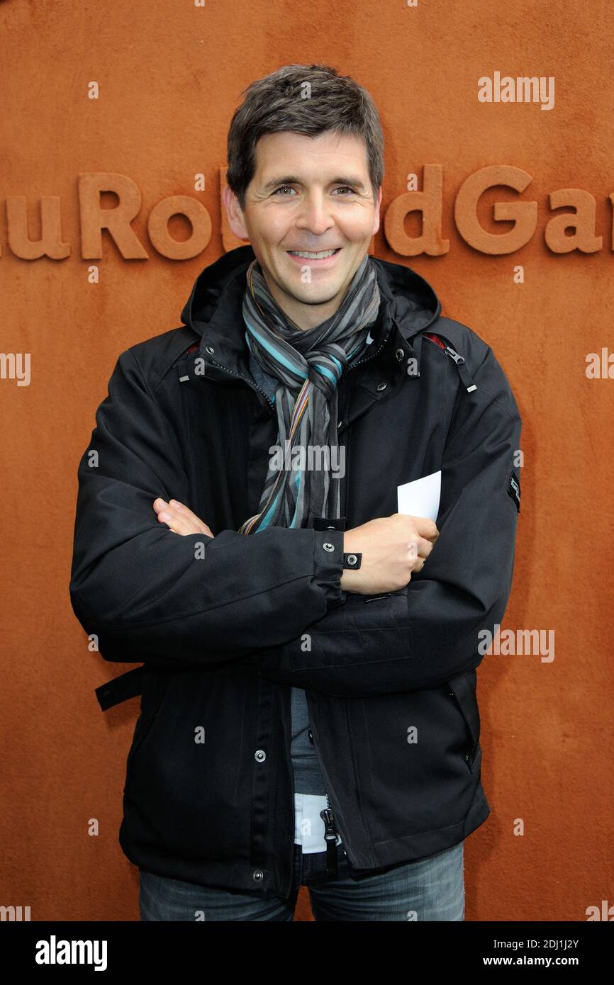 Thomas Sotto posing at the Village during French Tennis Open at Roland