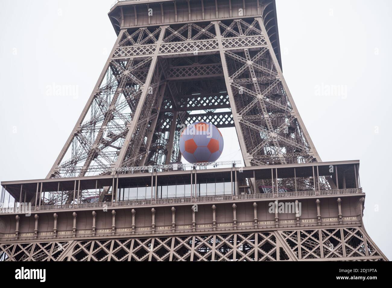 An inflated ball hung inside the Eiffel Tower next to the under