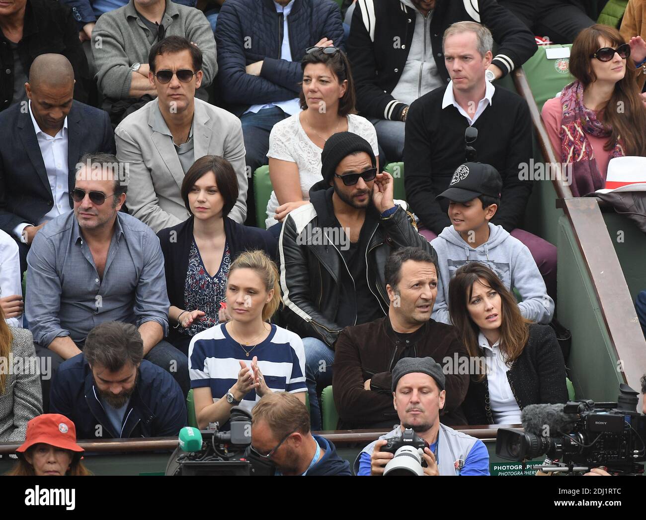 Actor Clive Owen, journalist Julien Arnaud, Jean Dujardin, Nathalie Pechalat, singer Maxime Nucci and son Aaron, Clovis Cornillac and his wife Lilou Fogli, TV Host Arthur Essebag and Mareva Galanter attend Day Fifteen, Men single's Final of the 2016 French Tennis Open at Roland Garros on June 5, 2016 in Paris, France. Photo by Laurent Zabulon/ABACAPRESS.COM Stock Photo