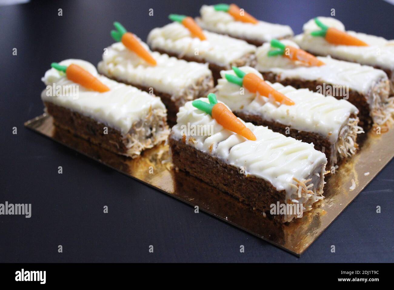 Carrot Cake With Cute Baby Carrots And Cream Cheese On A Golden Tray Stock Photo Alamy
