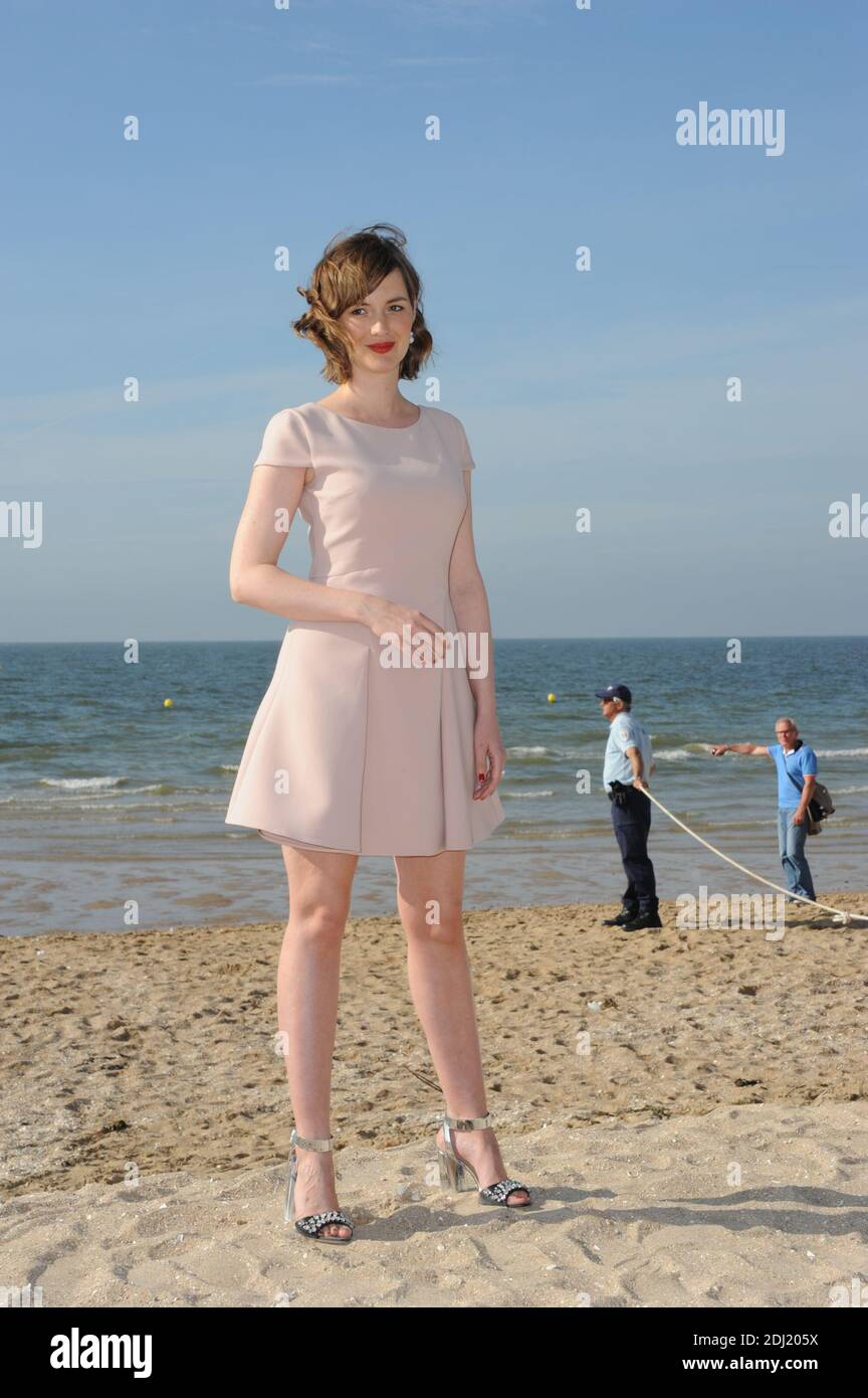Louise Bourgoin posing for a photocall on the beach during the 30th