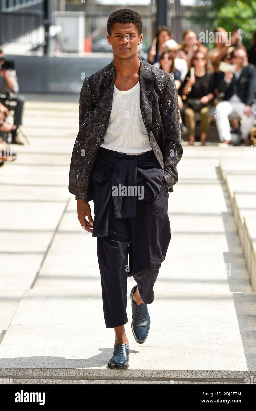 A model walks the runway during the Issey Miyake Men Menswear Spring Summer 2017 show designed by Yusuke Takahashi as part of Paris Fashion Week on June 23 2016 in Paris France. Photo