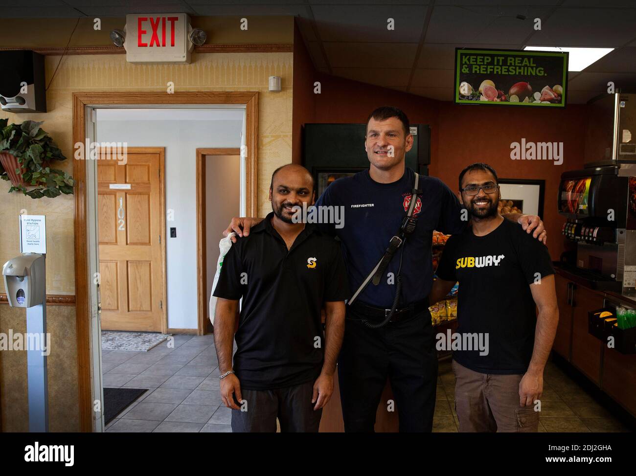 July 21, 2019: Former MMA heavyweight champ Stipe Miocic has been a part time Valley View, Ohio firefighter since 2010. Stipe has his picture taken with two subway workers and fans during his lunch break. Photo by Michael F McElroy Credit: Michael McElroy/ZUMA Wire/Alamy Live News Stock Photo