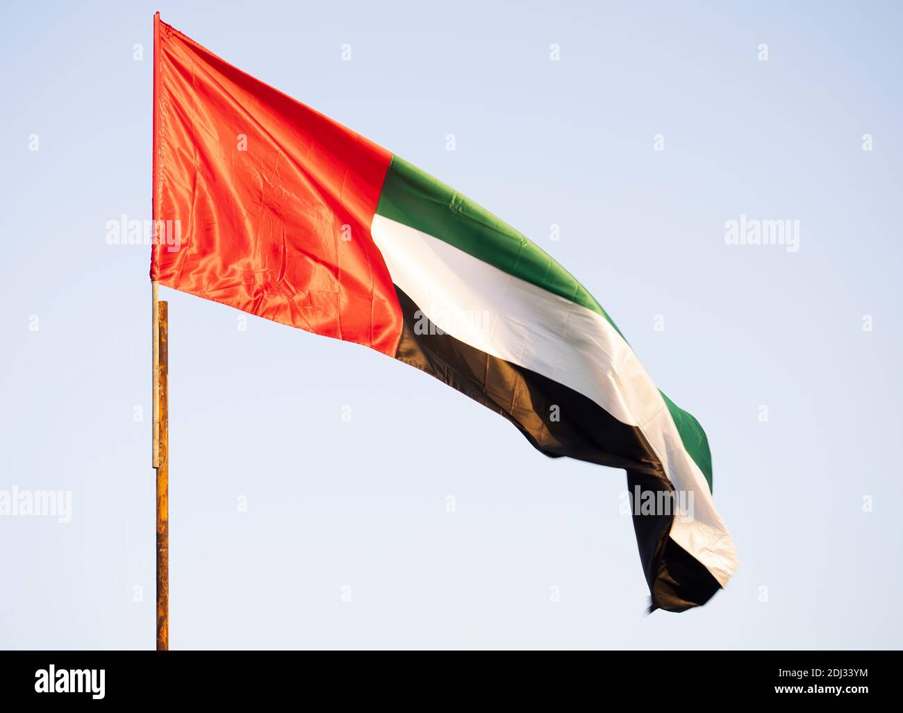 A United Arab Emirates flag flying proudly in the morning breeze Stock Photo