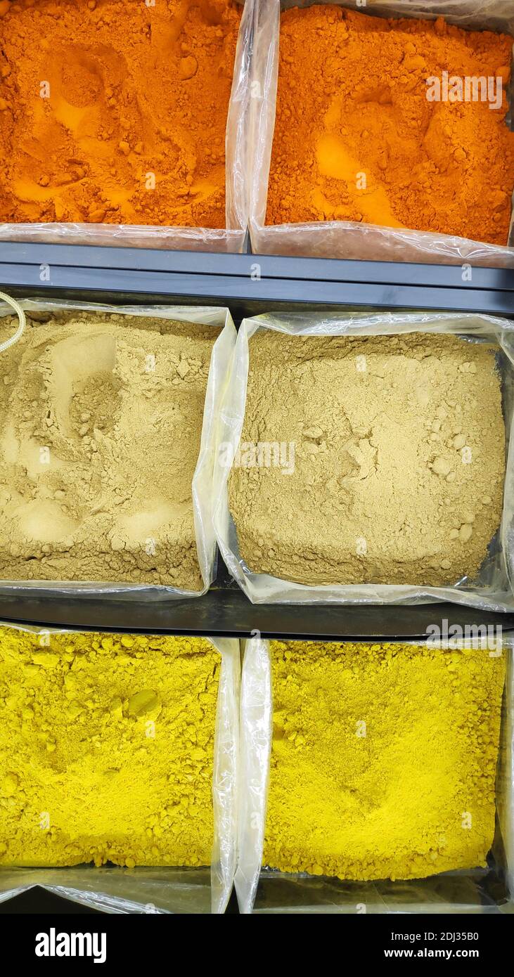 Various type of curry powders on market for sell Stock Photo