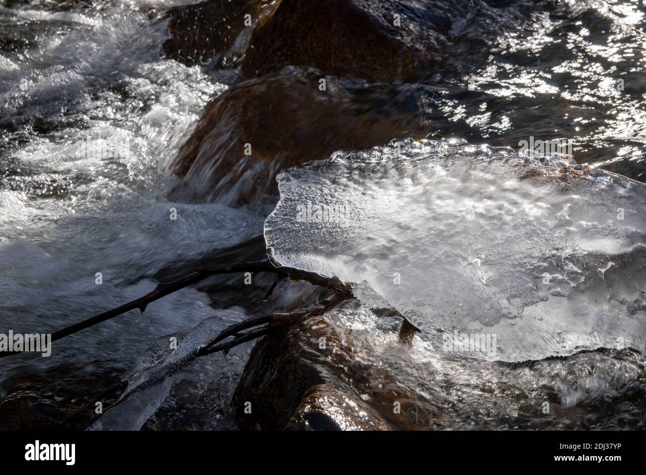 Big Pine Creek freezes in the winter. It offers spectacular mountain views above Big Pine, Inyo County, CA, USA. Stock Photo
