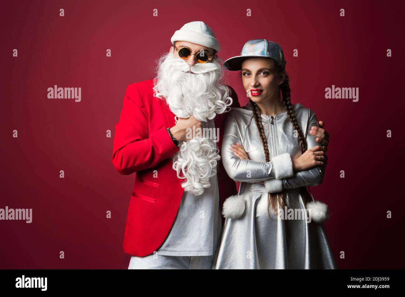Dj Santa Claus with Sunglasses and Headphones Listening to Christmas Music  and Snow Maiden Having Fun. Hip Hop Xmas Party Time Stock Photo - Alamy